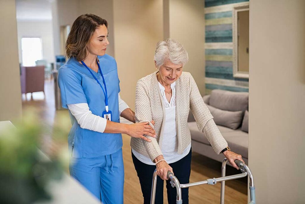 Older adults sharing a nutritious meal together at a dining table in an assisted living setting.